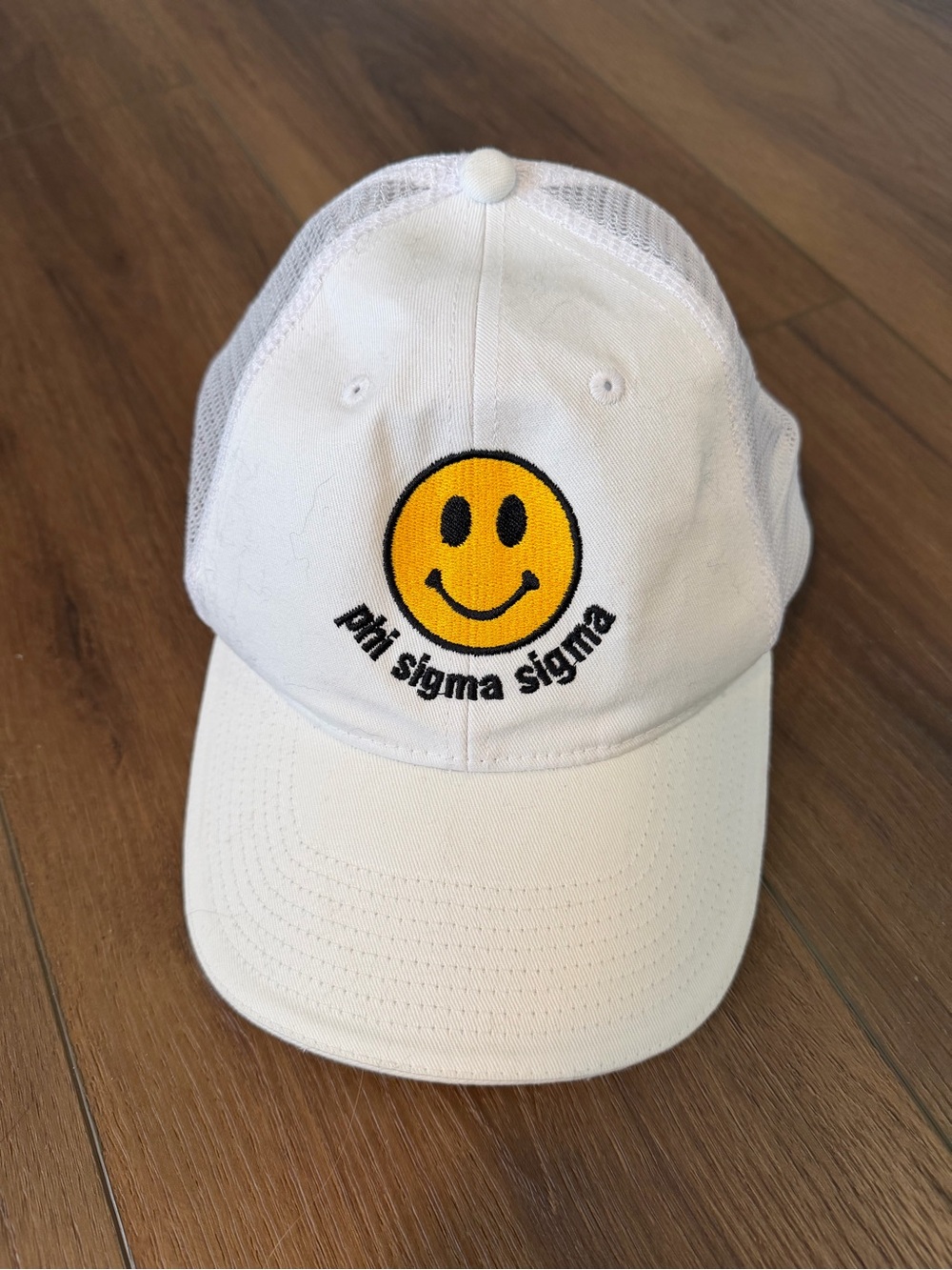 White Mesh-Back Hat with Yellow Smiley Patch